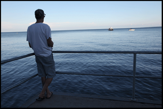 Photograph of man on deck in Normandale, on the Gold Coast in southern Ontario